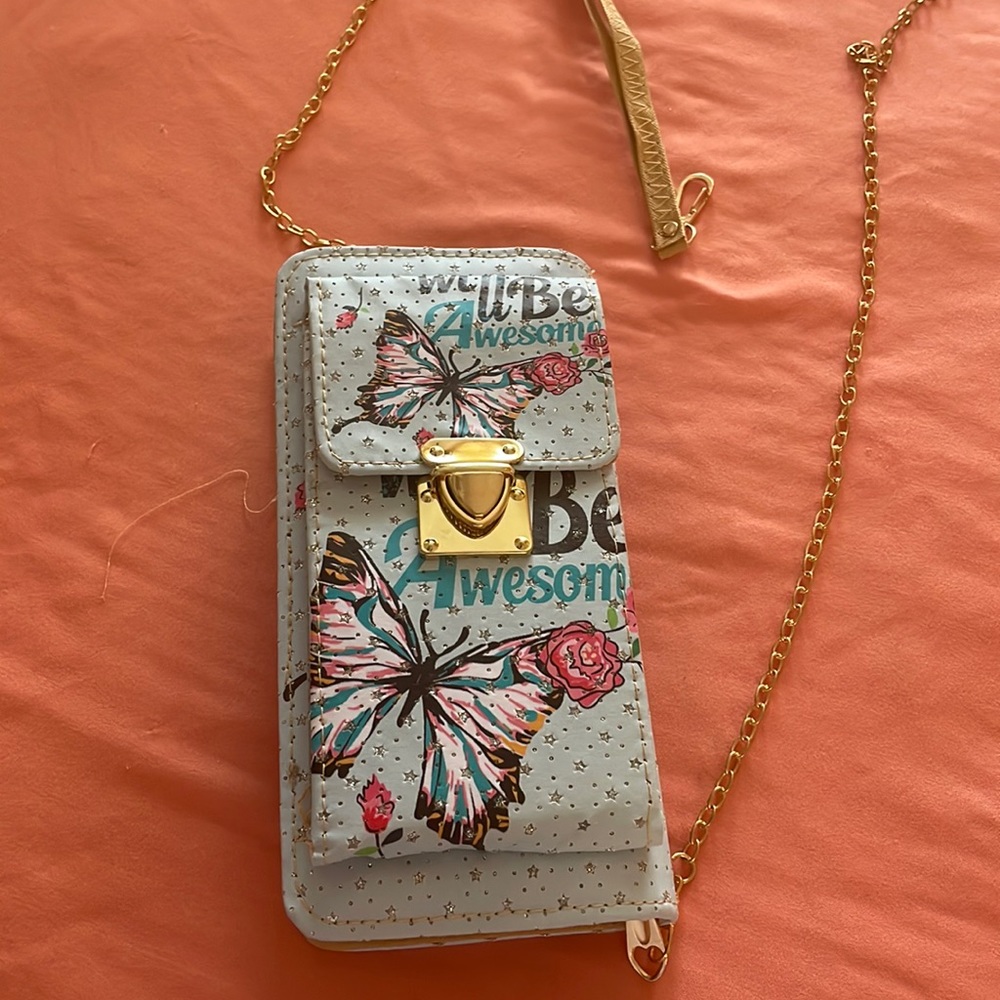 Pretty purse with space for your phone. Ladies is great !Carry all in one!!